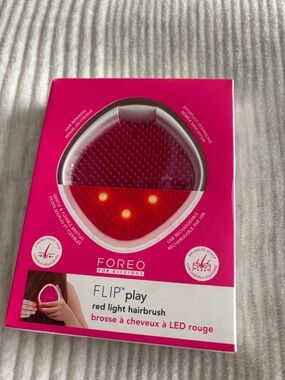 FOREO Flip Play Hairbrush in Hot Pink with Red LED
